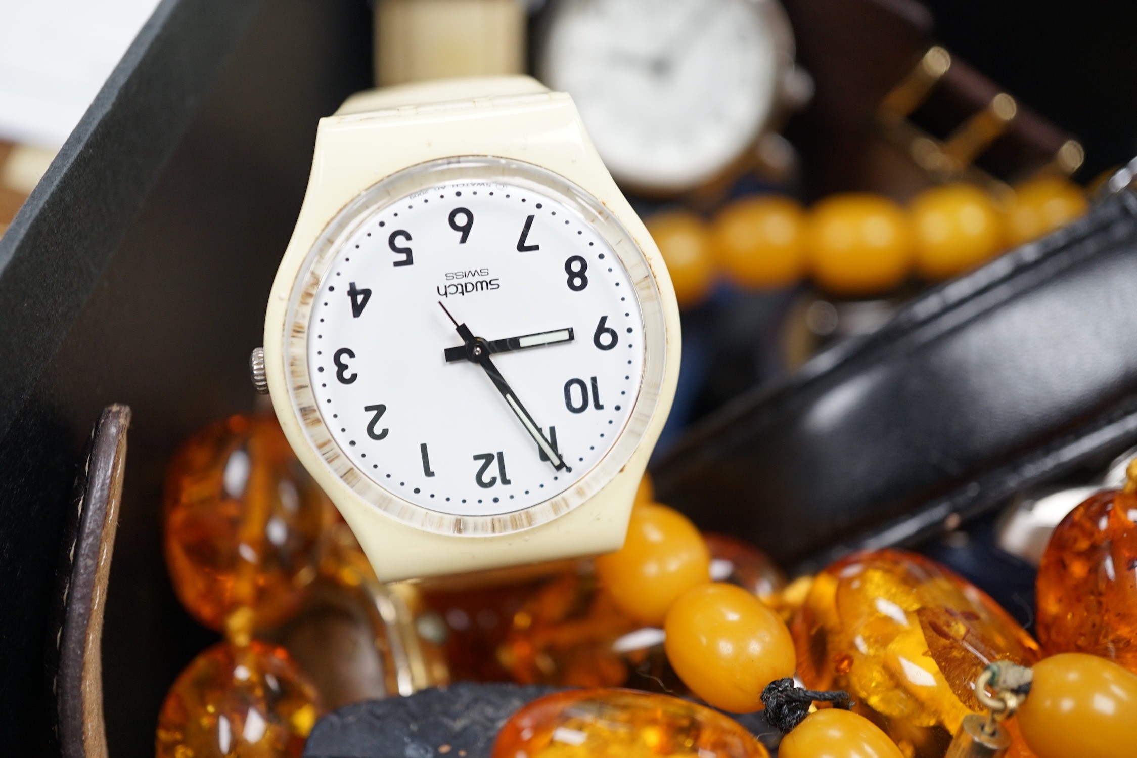 A quantity of assorted gentleman's modern wrist watches and two necklaces including amber style.
